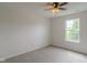 Bright bedroom featuring neutral walls, carpet, a window and a ceiling fan with light fixture at 2485 Bristol Dr, Franklin, IN 46131