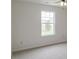 Bedroom featuring neutral walls, neutral carpeting, a ceiling fan, and a window overlooking the backyard at 2485 Bristol Dr, Franklin, IN 46131