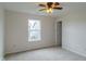 Well-lit bedroom with neutral walls, carpet, ceiling fan, and a window with neighborhood view at 2485 Bristol Dr, Franklin, IN 46131