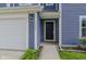 Close-up of home's entrance featuring the front door, house number, and siding detail at 2485 Bristol Dr, Franklin, IN 46131