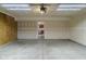 Clean, unfinished garage space with a door that leads to a modern-style kitchen at 2485 Bristol Dr, Franklin, IN 46131