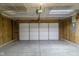 Spacious garage with a white door and overhead lighting providing ample space for parking and storage at 2485 Bristol Dr, Franklin, IN 46131