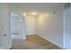 Hallway with neutral walls, modern flooring and a view into another room at 2485 Bristol Dr, Franklin, IN 46131