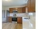 Bright kitchen featuring stainless steel appliances, wood cabinets and light countertops at 2485 Bristol Dr, Franklin, IN 46131