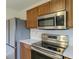 Modern kitchen with stainless steel appliances, bright countertops and wood cabinets at 2485 Bristol Dr, Franklin, IN 46131