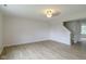 Bright, open-concept living room featuring hard surface floors and neutral walls with stairway access at 2485 Bristol Dr, Franklin, IN 46131