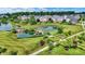 Scenic aerial view of a neighborhood with lush landscaping, serene ponds, and sidewalks at 2789 W High Grove Cir, Zionsville, IN 46077