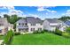 Aerial view of a backyard shows manicured lawn and a patio area for outdoor enjoyment and entertaining at 2789 W High Grove Cir, Zionsville, IN 46077