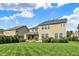 Expansive backyard featuring a lush lawn, patio, and views of neighboring houses at 2789 W High Grove Cir, Zionsville, IN 46077