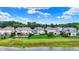Backyards of houses line a waterway with some featuring pools and patios, enhancing the property's appeal at 2789 W High Grove Cir, Zionsville, IN 46077