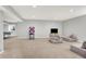 Spacious finished basement featuring plush carpeting, recessed lighting, and comfortable seating arrangements at 2789 W High Grove Cir, Zionsville, IN 46077