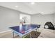 Basement with a ping pong table, carpeted floor, and open space to the other rooms at 2789 W High Grove Cir, Zionsville, IN 46077