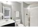 Bright bathroom featuring a glass-enclosed shower, white vanity with sleek hardware, and neutral color palette at 2789 W High Grove Cir, Zionsville, IN 46077