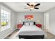 Comfortable bedroom featuring a ceiling fan, bedside tables, and a picturesque view from the bright window at 2789 W High Grove Cir, Zionsville, IN 46077