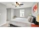 A spacious bedroom with natural light, offering a cozy space with a ceiling fan and a modern touch at 2789 W High Grove Cir, Zionsville, IN 46077