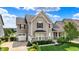 Charming two-story home with manicured lawn and beautiful landscaping near a pond at 2789 W High Grove Cir, Zionsville, IN 46077