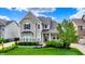 Attractive two-story home features a well-manicured lawn, appealing landscaping, and inviting front entrance at 2789 W High Grove Cir, Zionsville, IN 46077