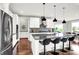 Modern kitchen with granite countertops, stainless steel appliances, and a kitchen island with seating at 2789 W High Grove Cir, Zionsville, IN 46077