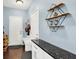 Stylish mud room with built-in storage, granite countertop, and easy access to both the garage and main living areas at 2789 W High Grove Cir, Zionsville, IN 46077