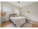 Cozy bedroom with ceiling fan and a modern rug and decor at 2831 N Talbott St, Indianapolis, IN 46205