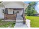 Welcoming front porch with brick accents and decorative flower pots to either side of the stairs at 2831 N Talbott St, Indianapolis, IN 46205