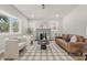 Bright living room with large bay window, fireplace, and a stylish decor rug at 2831 N Talbott St, Indianapolis, IN 46205