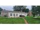 Spacious backyard featuring well-maintained lawn, patio seating, and a charming brick pathway at 3039 28Th St, Columbus, IN 47203