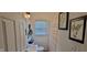 Bathroom with decorative art, a vanity sink, and a window at 3039 28Th St, Columbus, IN 47203