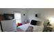 Bright bedroom with a large window, comfortable furnishings, and minimalist decor at 3039 28Th St, Columbus, IN 47203