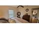 Bedroom featuring a neutral color palette, dresser, and a comfortable bed at 3039 28Th St, Columbus, IN 47203