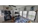 Bright bedroom featuring a blue quilt and natural light from three windows at 3039 28Th St, Columbus, IN 47203