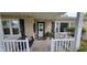 Inviting front porch with a porch swing and white railings at 3039 28Th St, Columbus, IN 47203