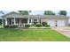 Charming ranch-style home with well-manicured lawn and stone exterior at 3039 28Th St, Columbus, IN 47203