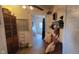 Hallway with a decorative bench and view to the bathroom at 3039 28Th St, Columbus, IN 47203