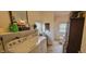 Laundry area with washer, dryer, shelving, and adjacent powder room for convenience at 3039 28Th St, Columbus, IN 47203