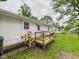 Backyard view of wooden deck and access to the yard at 308 Mohawk St, Anderson, IN 46012