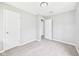 Neutral bedroom with soft carpet, light gray walls, and multiple doorways at 308 Mohawk St, Anderson, IN 46012