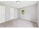 Neutral bedroom featuring soft carpet, one window, and light gray walls at 308 Mohawk St, Anderson, IN 46012