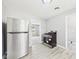 Updated kitchen featuring stainless steel appliances, modern cabinetry, and wood-look flooring at 308 Mohawk St, Anderson, IN 46012