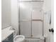 Functional bathroom featuring a shower and toilet with tiled walls at 3303 Wedgewood Dr, Indianapolis, IN 46227