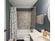 This bathroom is well-lit with a tub-shower combo, vanity, and decorative mirror for a relaxing space at 3303 Wedgewood Dr, Indianapolis, IN 46227