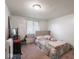 Comfortable bedroom featuring a bed, window, and desk, ideal for relaxation and productivity at 3303 Wedgewood Dr, Indianapolis, IN 46227