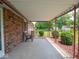 Spacious covered patio with seating area, perfect for enjoying the outdoors in a comfortable setting at 3303 Wedgewood Dr, Indianapolis, IN 46227