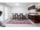 Dining room with a table and chairs, adjacent to the kitchen at 3303 Wedgewood Dr, Indianapolis, IN 46227