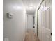 Bright hallway featuring white walls, neutral carpet, and access to multiple rooms at 3303 Wedgewood Dr, Indianapolis, IN 46227