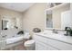 Bright bathroom with a vanity, toilet, mirror, and a soaking tub with white tiles at 3304 Fox Orchard Cir, Indianapolis, IN 46214
