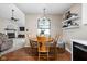 Cozy dining area featuring a wooden table and chairs, adjacent to the living room at 3304 Fox Orchard Cir, Indianapolis, IN 46214