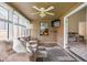 Bright sun room with a comfortable couch, ceiling fan, and natural light at 3304 Fox Orchard Cir, Indianapolis, IN 46214