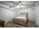 Cozy bedroom with neutral decor, a ceiling fan, and modern flooring at 350 N Meridian St # 505, Indianapolis, IN 46204