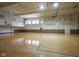 Spacious gymnasium with hardwood floors, basketball hoops, and ample natural light at 350 N Meridian St # 505, Indianapolis, IN 46204